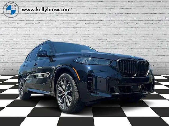 New 2026 Carbon Black Metallic BMW xDrive50e image 1