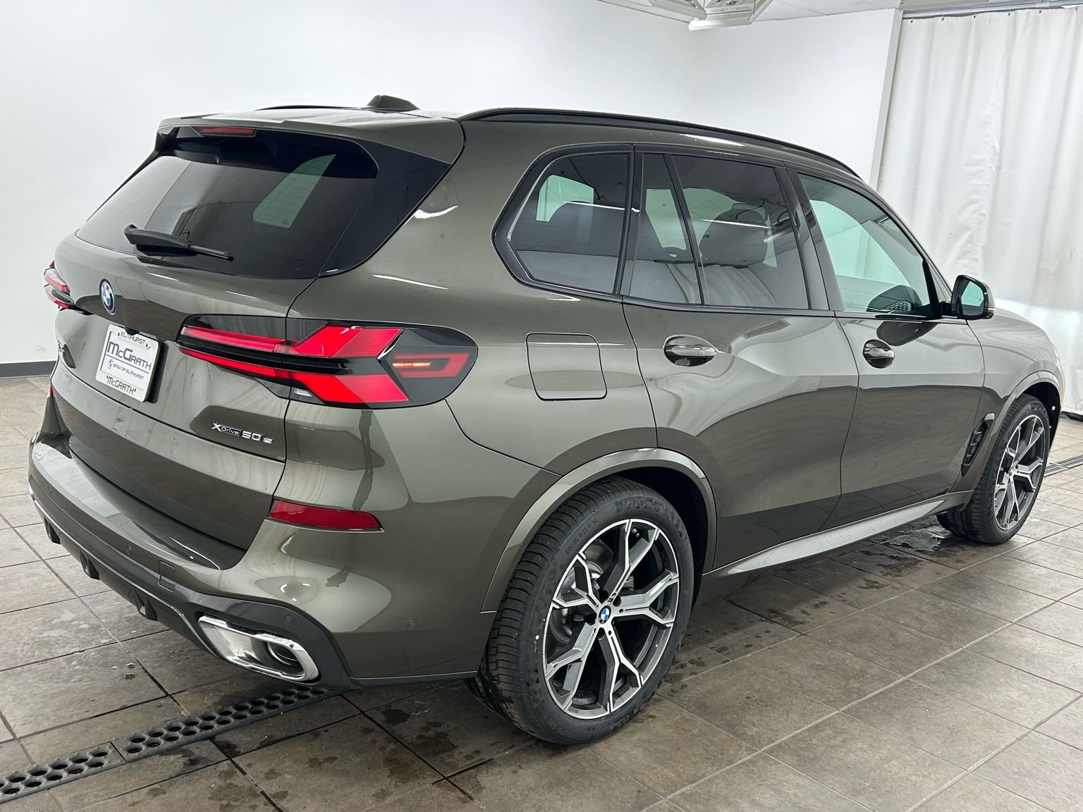 New 2026 Manhattan Green Metallic BMW xDrive50e image 7