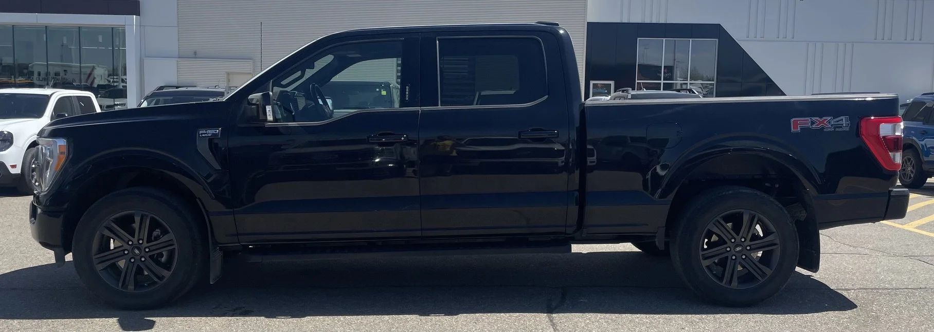 Used 2022 Black Ford LARIAT SuperCrew image 2
