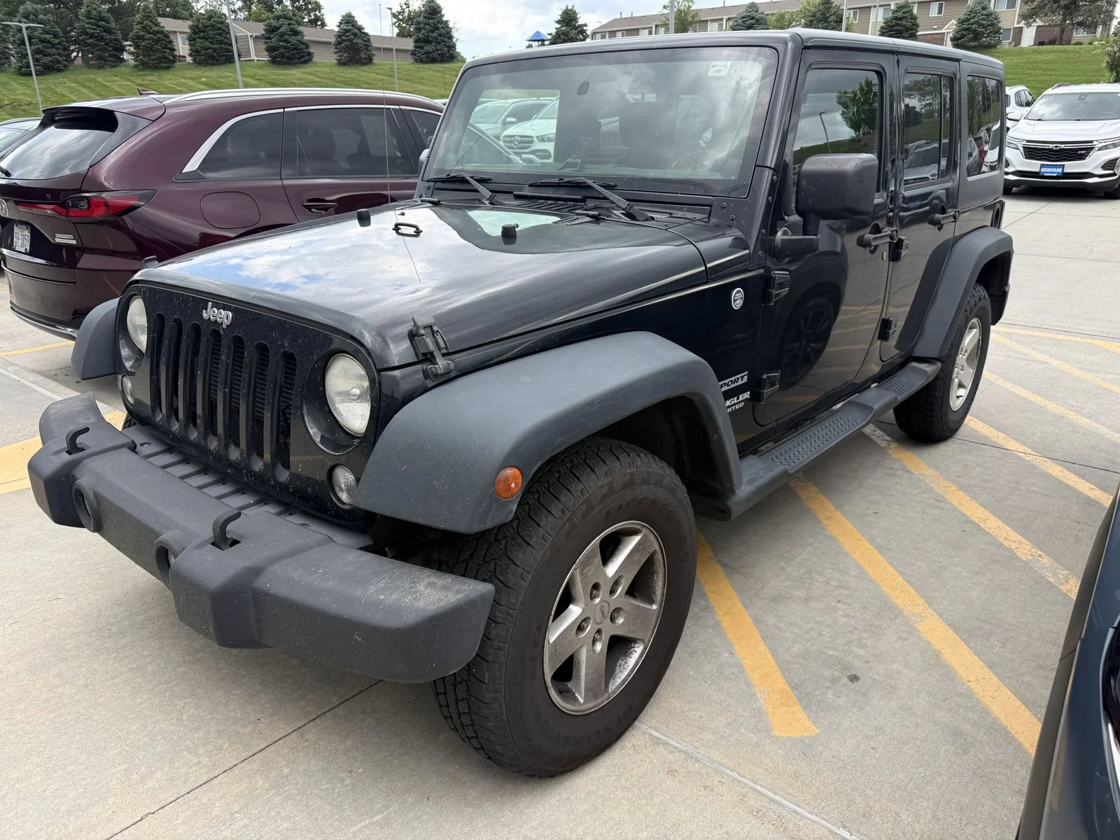 Used 2014 Black Jeep Unlimited Sport image 1