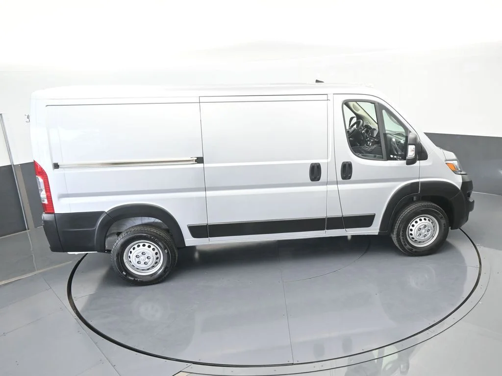 Used 2025 Bright Silver Clearcoat Metallic Ram Low Roof image 43