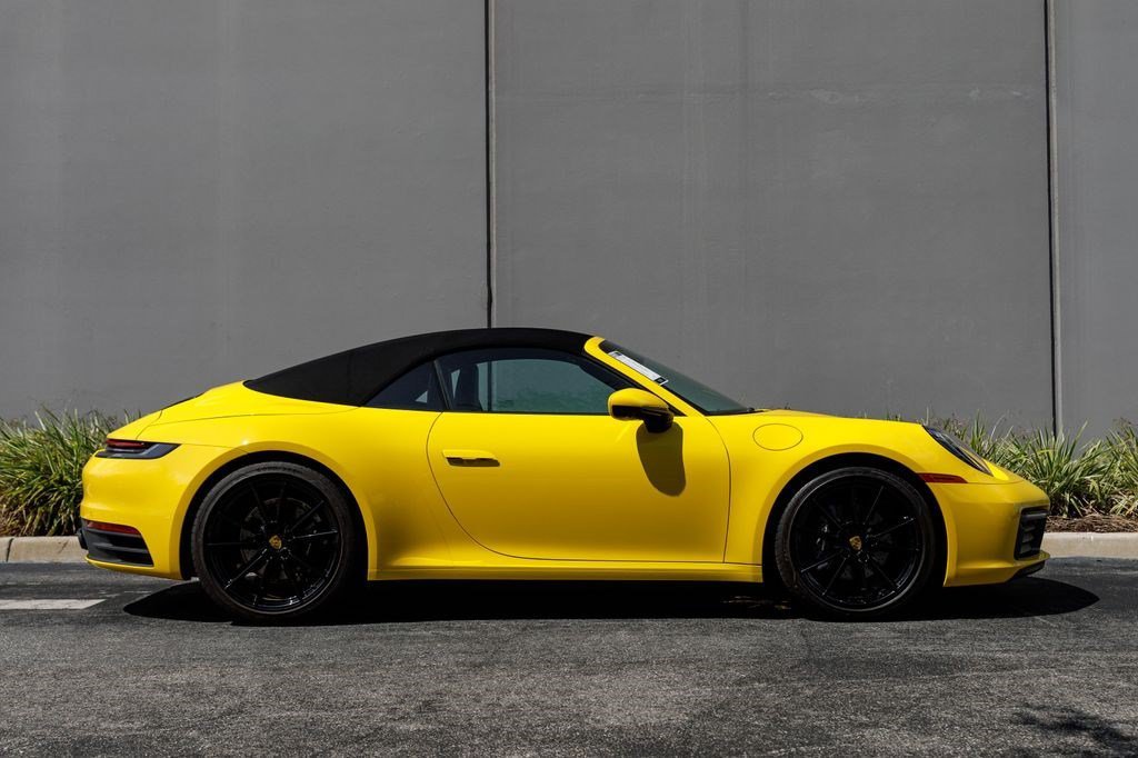 Used 2022 Racing Yellow Porsche Carrera image 6