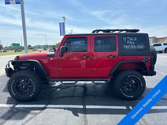 Used 2015 Firecracker Red Jeep Unlimited Sport image 11