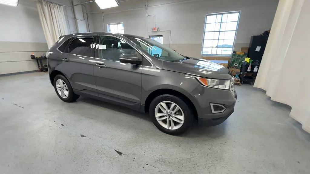 Used 2015 Magnetic Metallic Ford SEL image 2