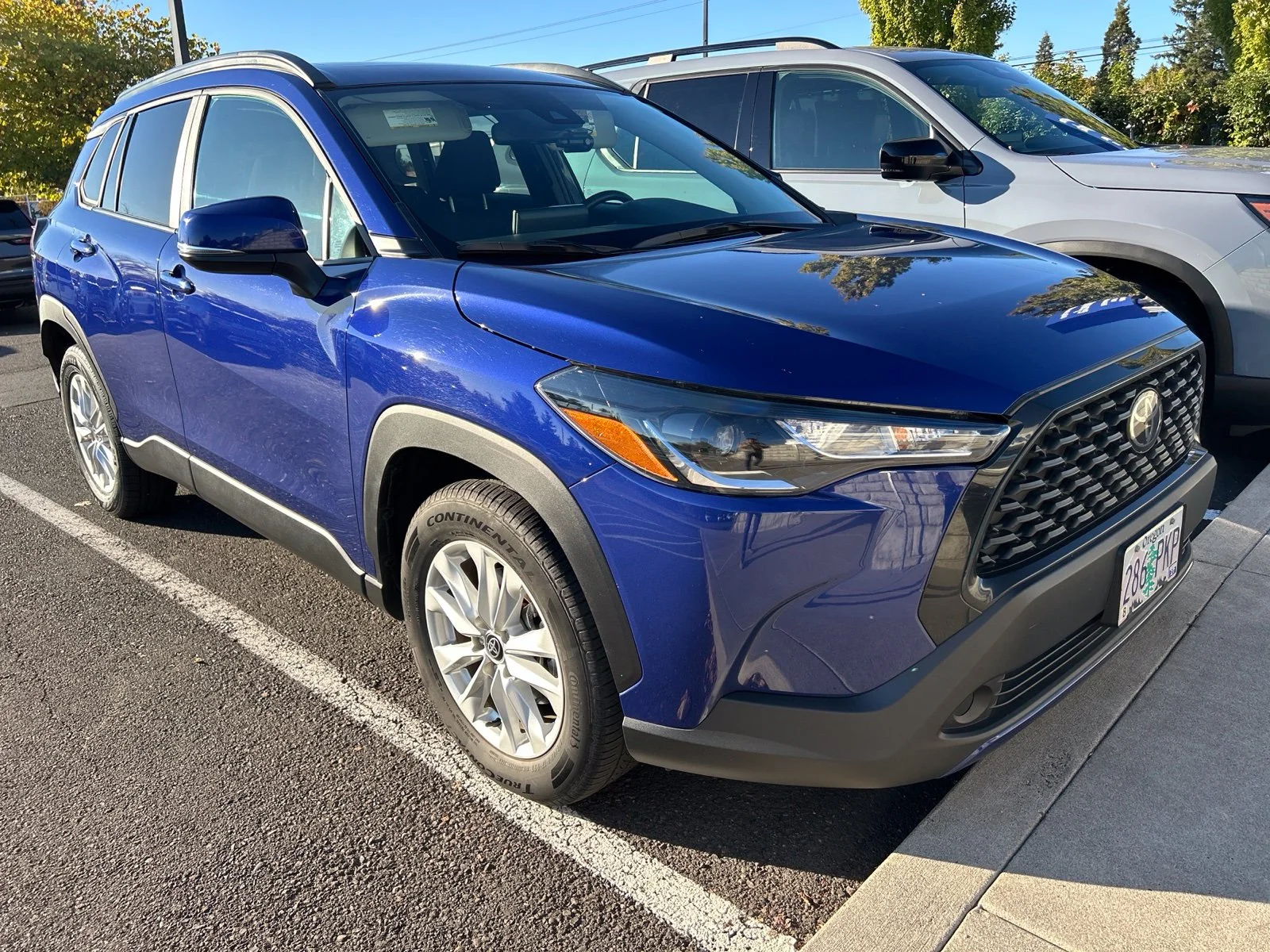 Used 2022 Blue Crush Metallic Toyota LE image 2