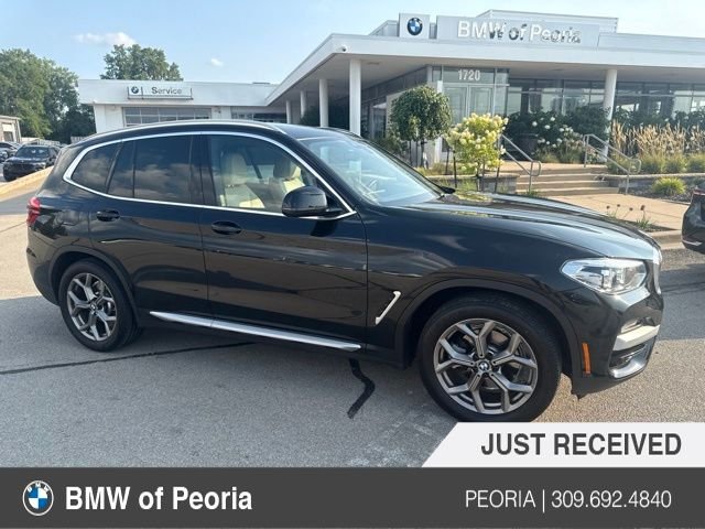 Used 2021 Black Sapphire Metallic BMW xDrive30i image 1