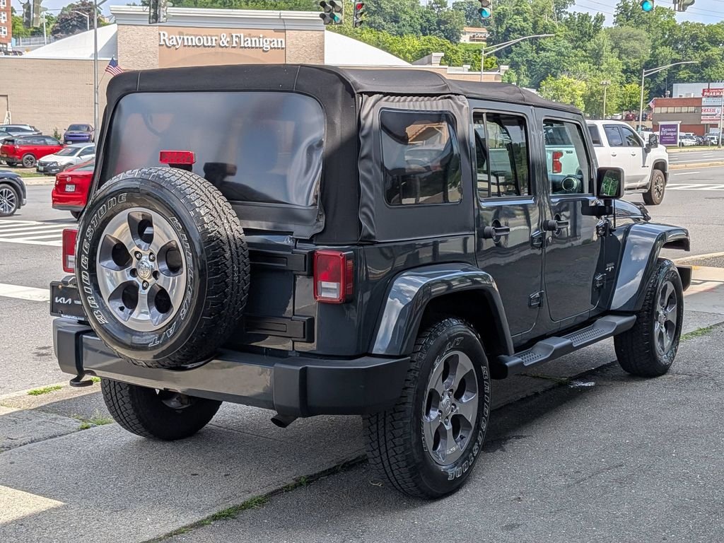 Used 2016 Black Jeep Unlimited Sahara image 6