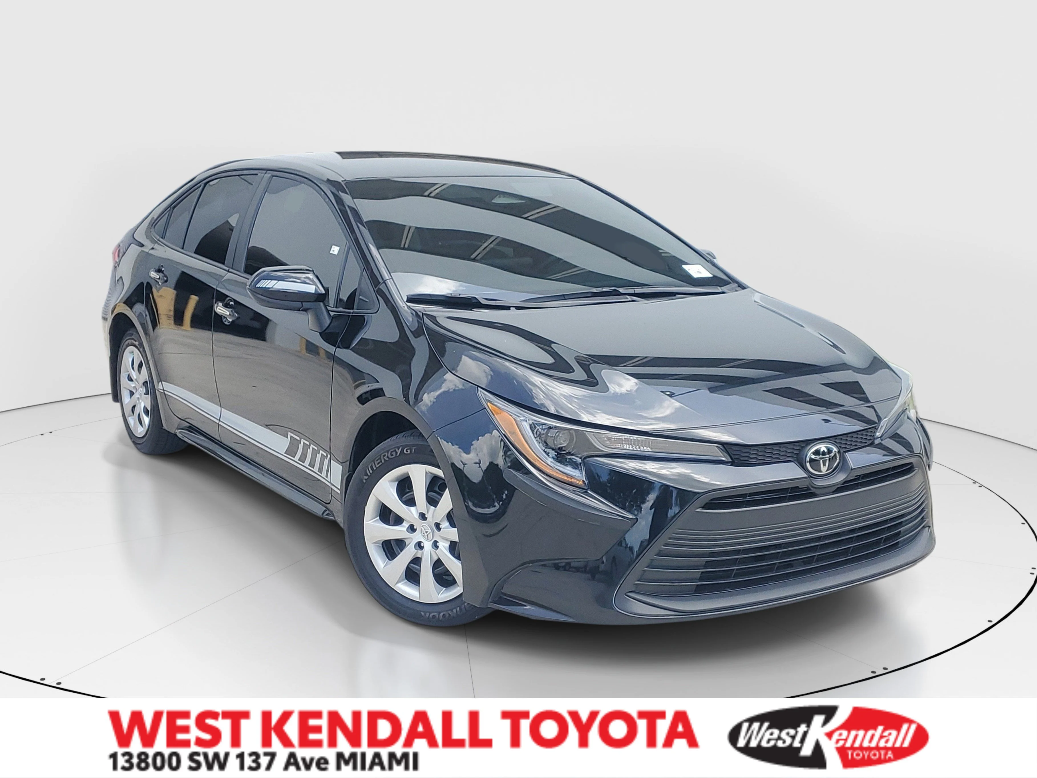 Used 2025 Midnight Black Metallic Toyota LE image 1