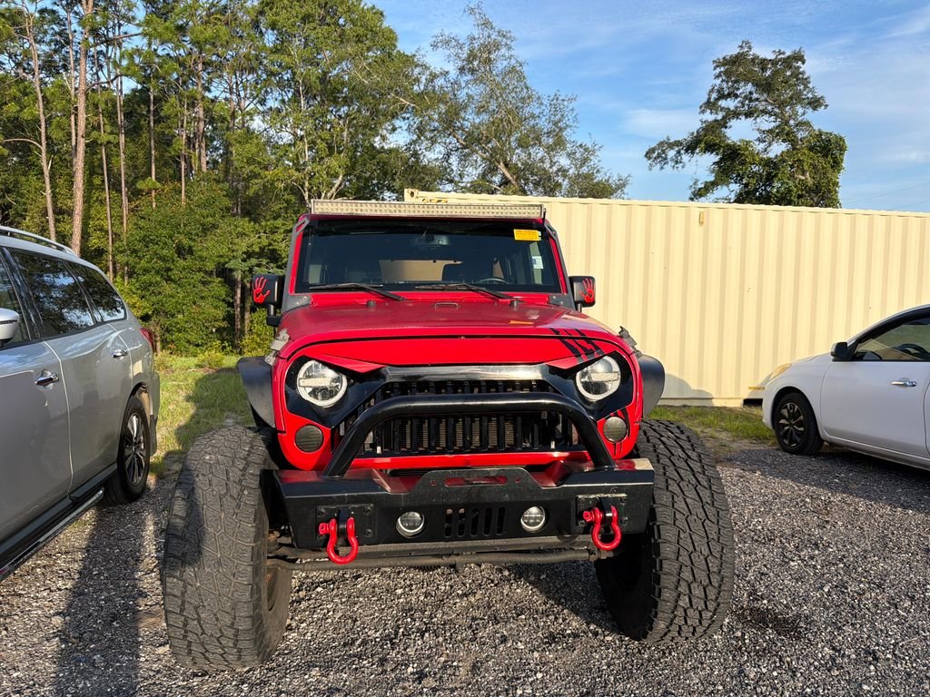 Used 2015 Firecracker Red Clear Coat Jeep Unlimited Sport image 2