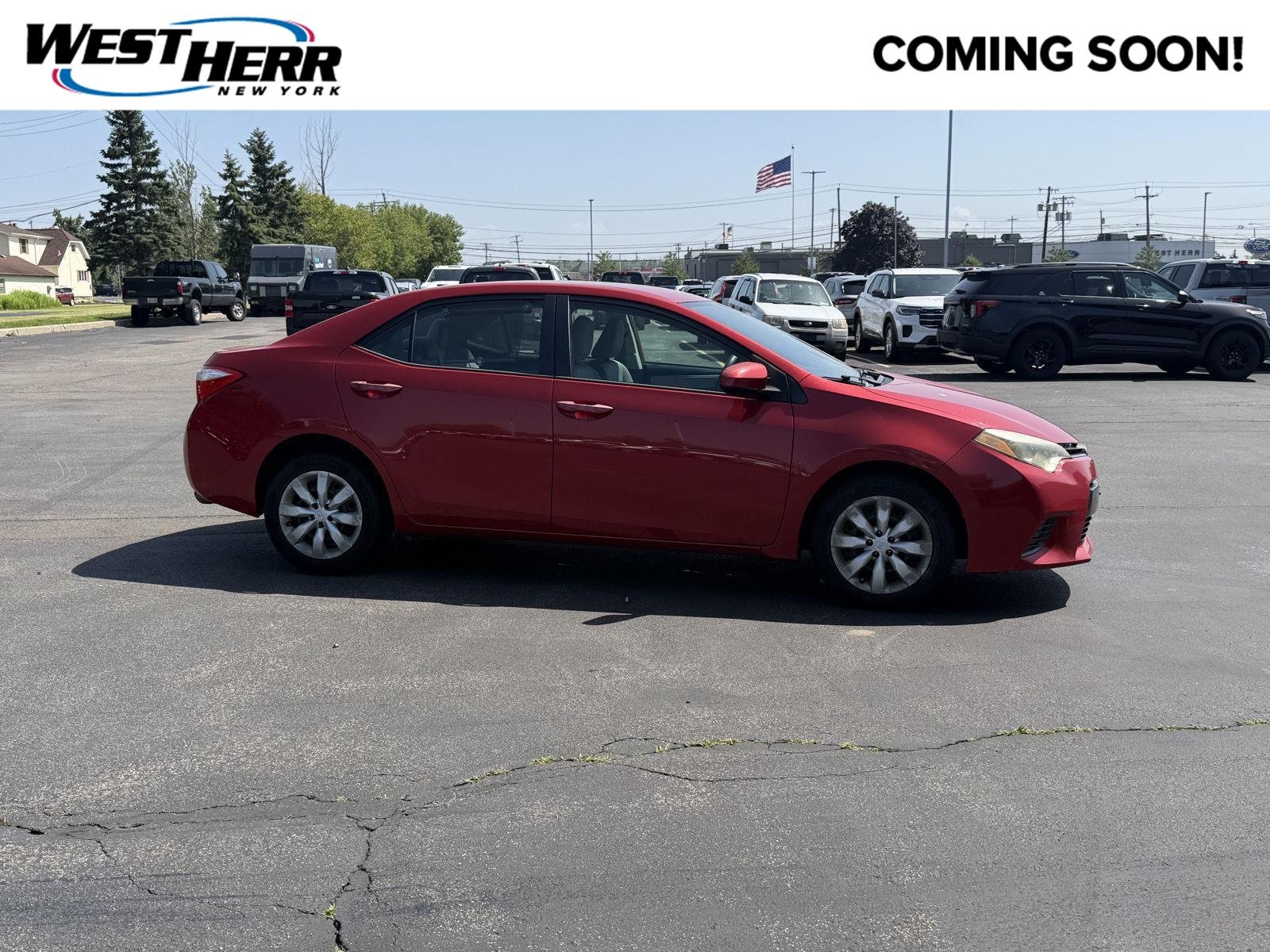 Used 2015 Barcelona Red Metallic Toyota LE image 1