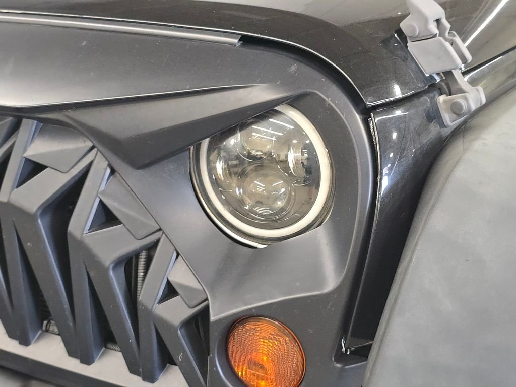 Used 2013 Black Jeep Unlimited Sport image 14