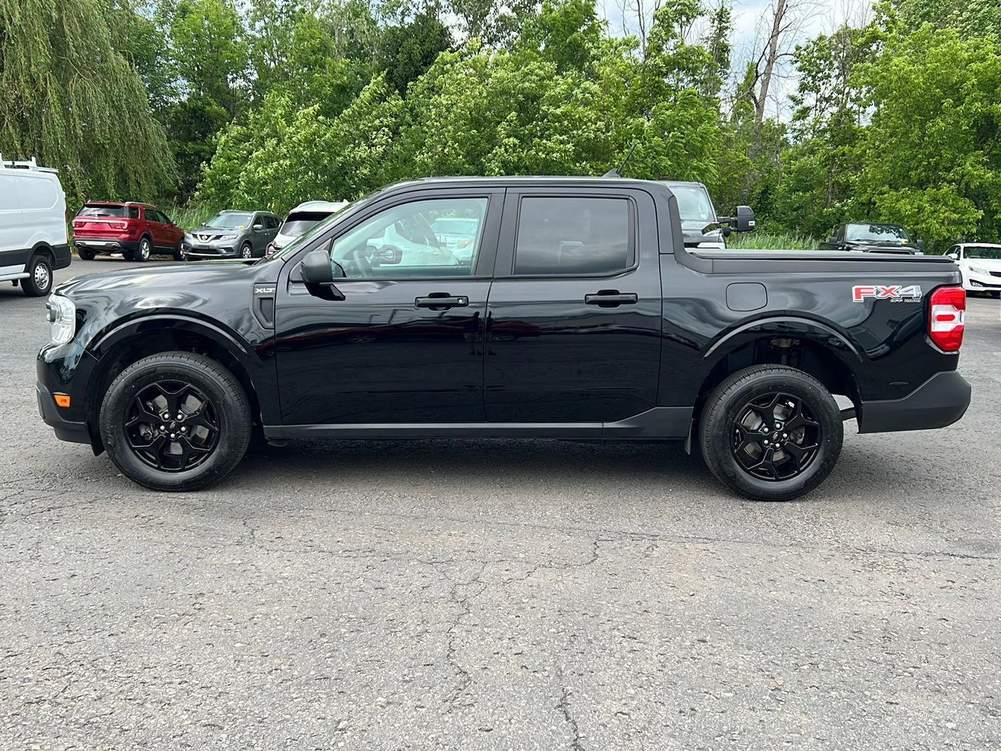 Used 2024 Shadow Black Ford XLT image 4