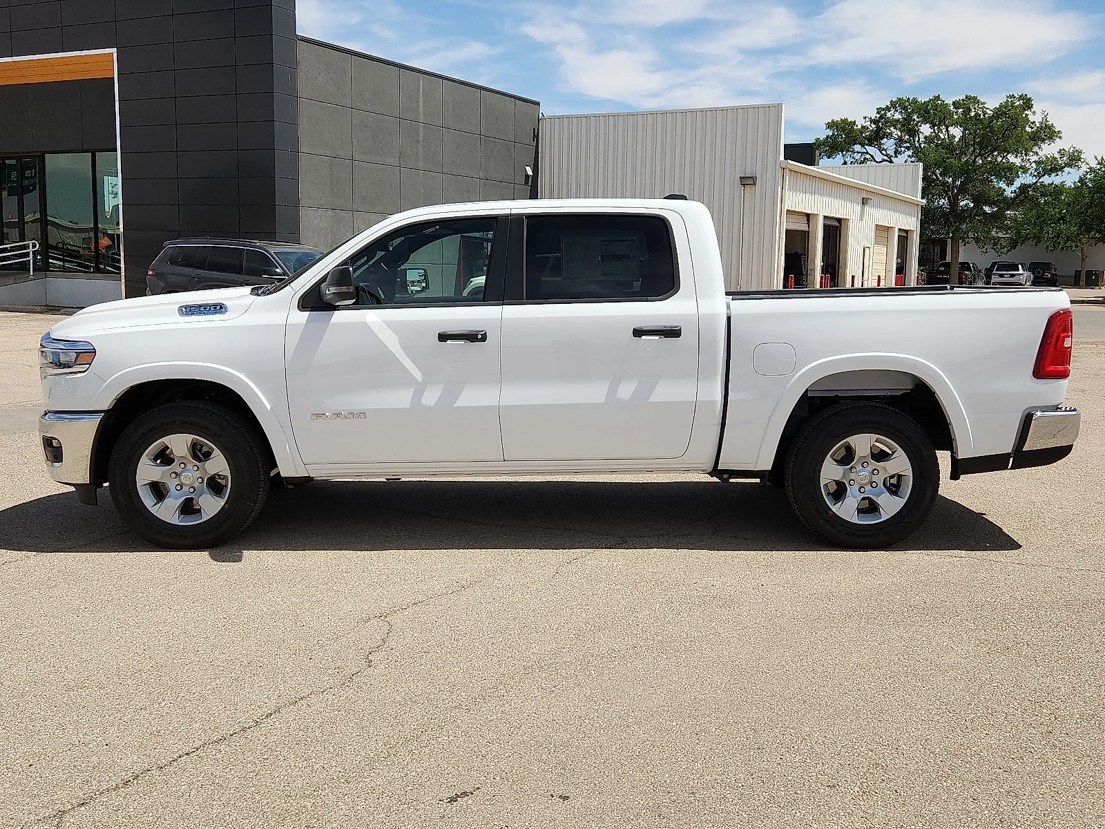 New 2026 Bright White Clearcoat Ram LONE STAR CREW CAB 4X4 5