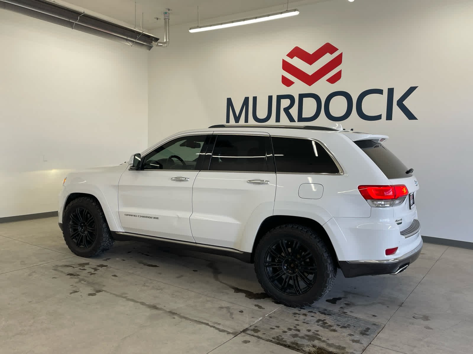 Used 2014 Jeep Grand Cherokee Summit with VIN 1C4RJFJM3EC418616 for sale in Logan, UT