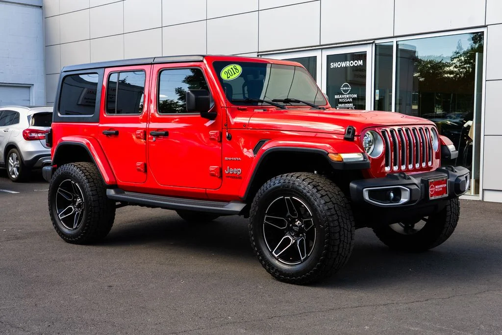 Used 2018 Red Jeep Unlimited Sahara image 1