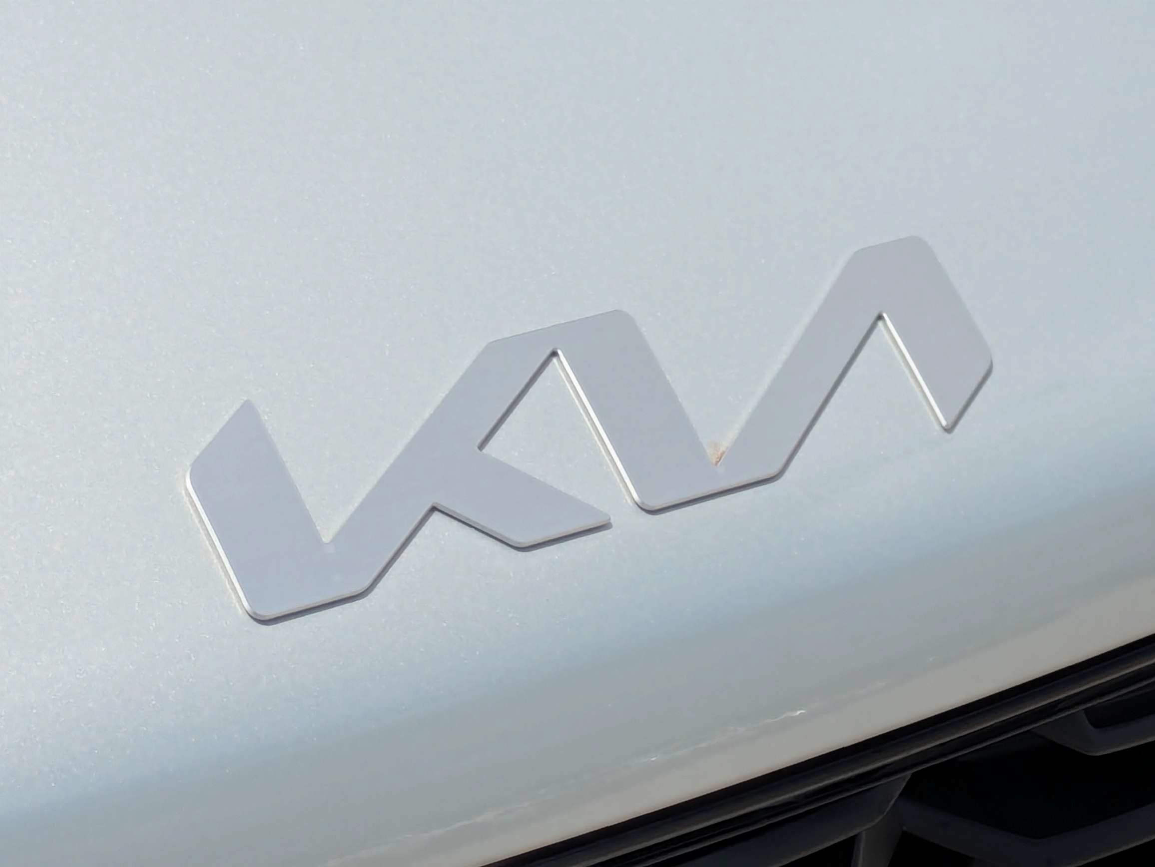 New 2026 Ivory Silver Kia LX image 13