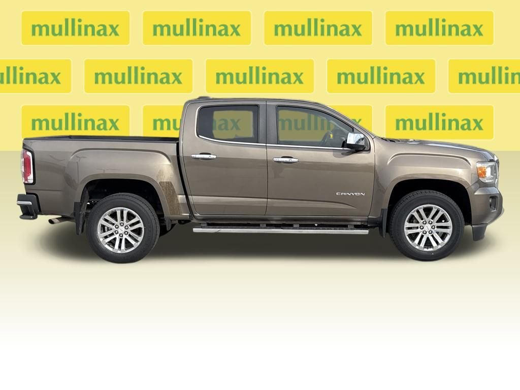 Used 2015 GMC Canyon SLT with VIN 1GTG5CE39F1184961 for sale in New Smyrna Beach, FL