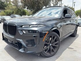 Certified Used 2025 Black Sapphire Metallic BMW xDrive40i image 1