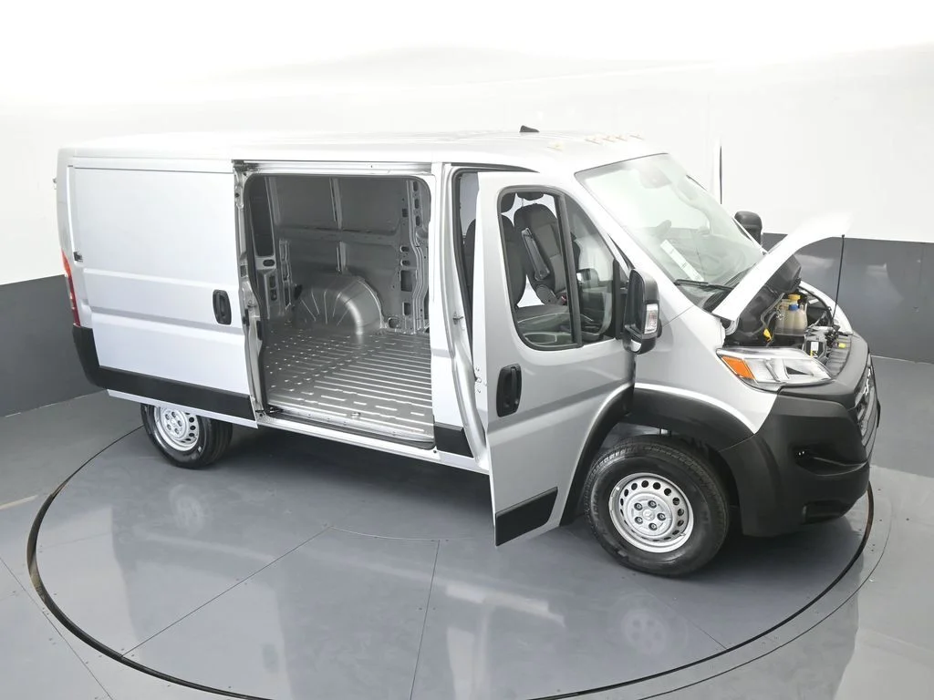 Used 2025 Bright Silver Clearcoat Metallic Ram Low Roof image 61