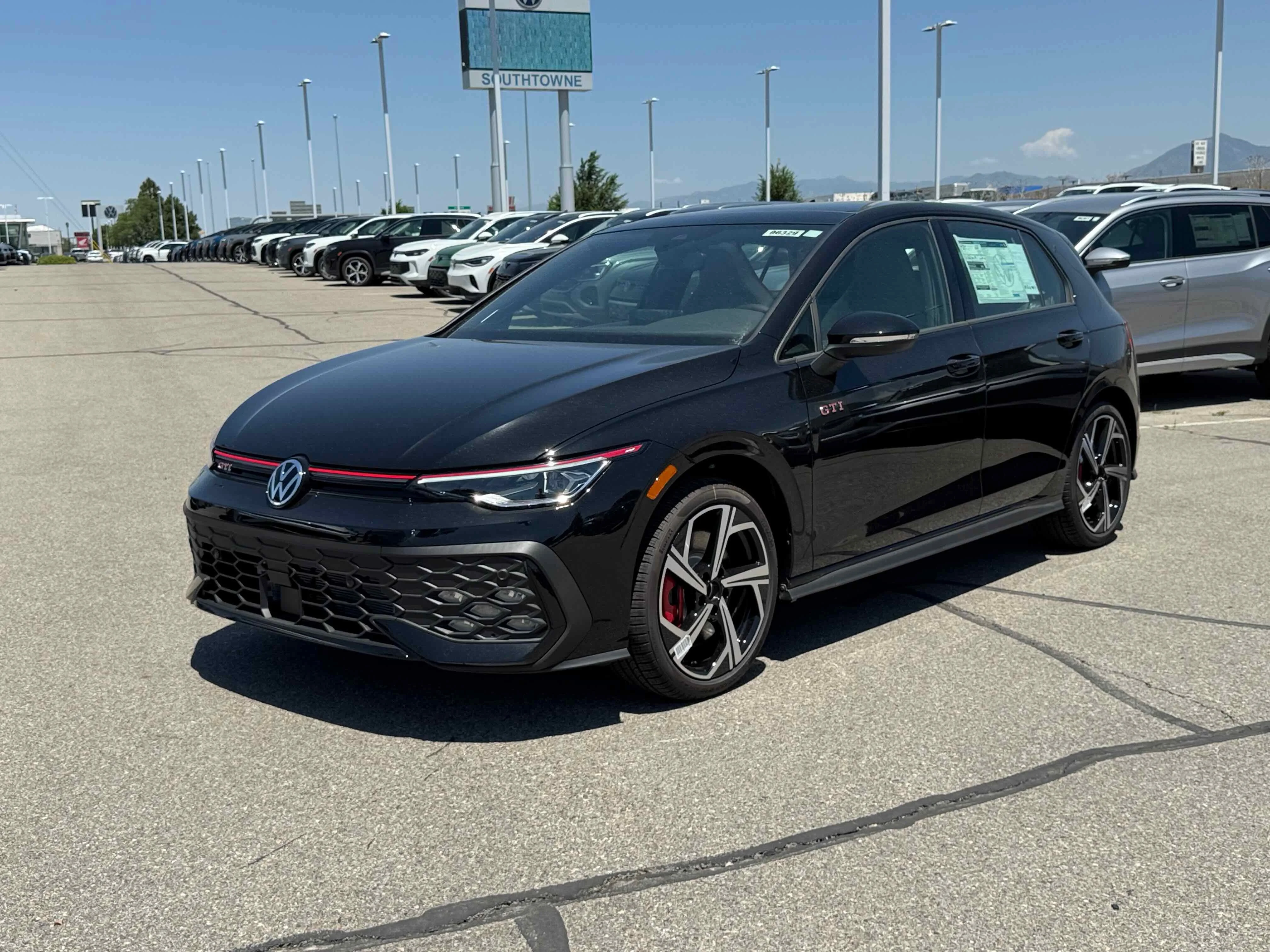 New 2025 Black Volkswagen SE image 1