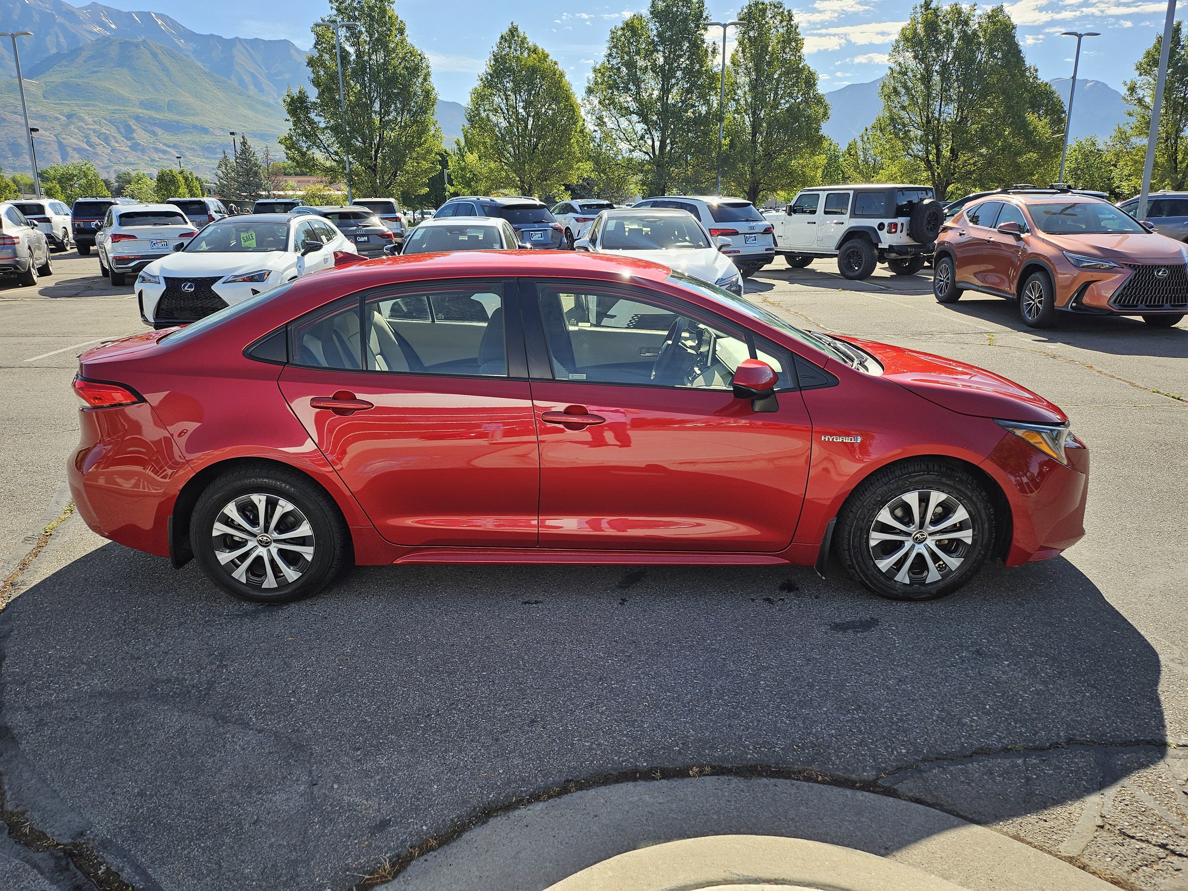 Used 2021 Barcelona Red Metallic Toyota LE image 4