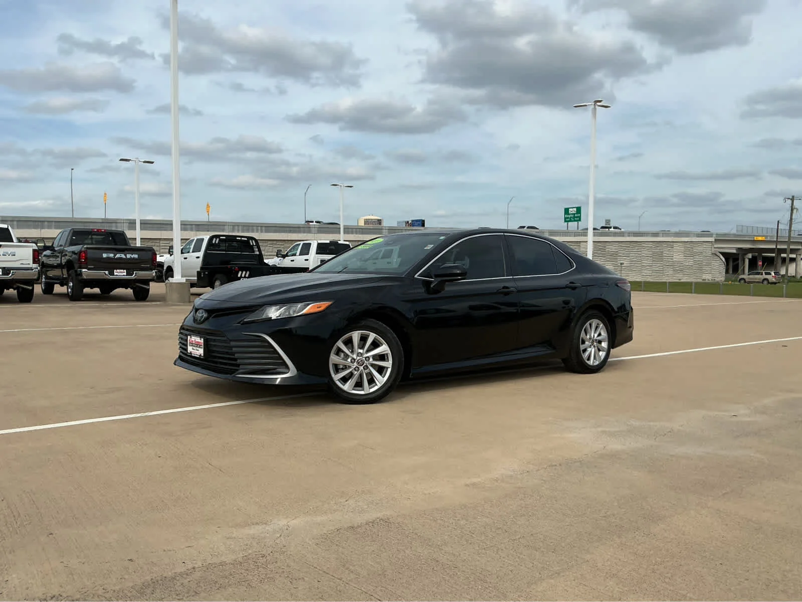 Used 2023 Midnight Black Metallic Toyota LE image 2