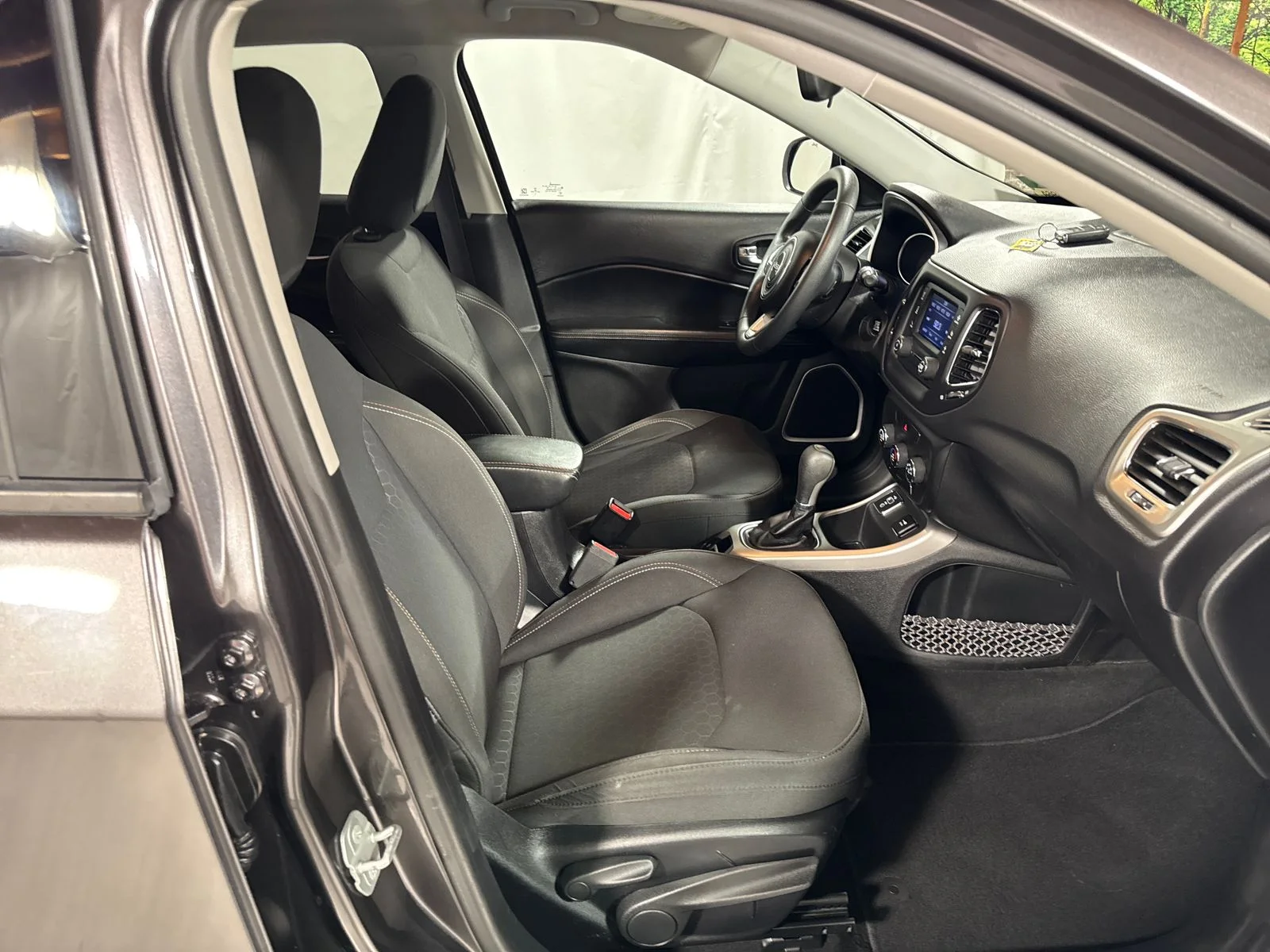 Used 2018 Granite Crystal Metallic Clearcoat Jeep Sport image 27