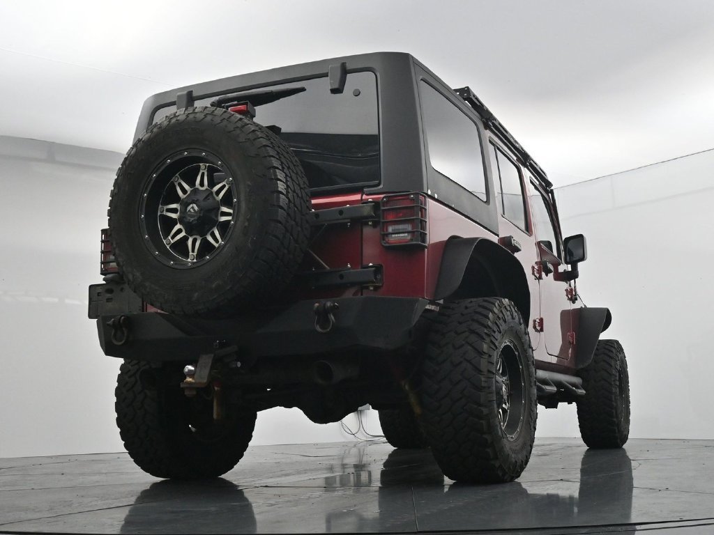 Used 2012 Red Jeep Unlimited Sport image 22