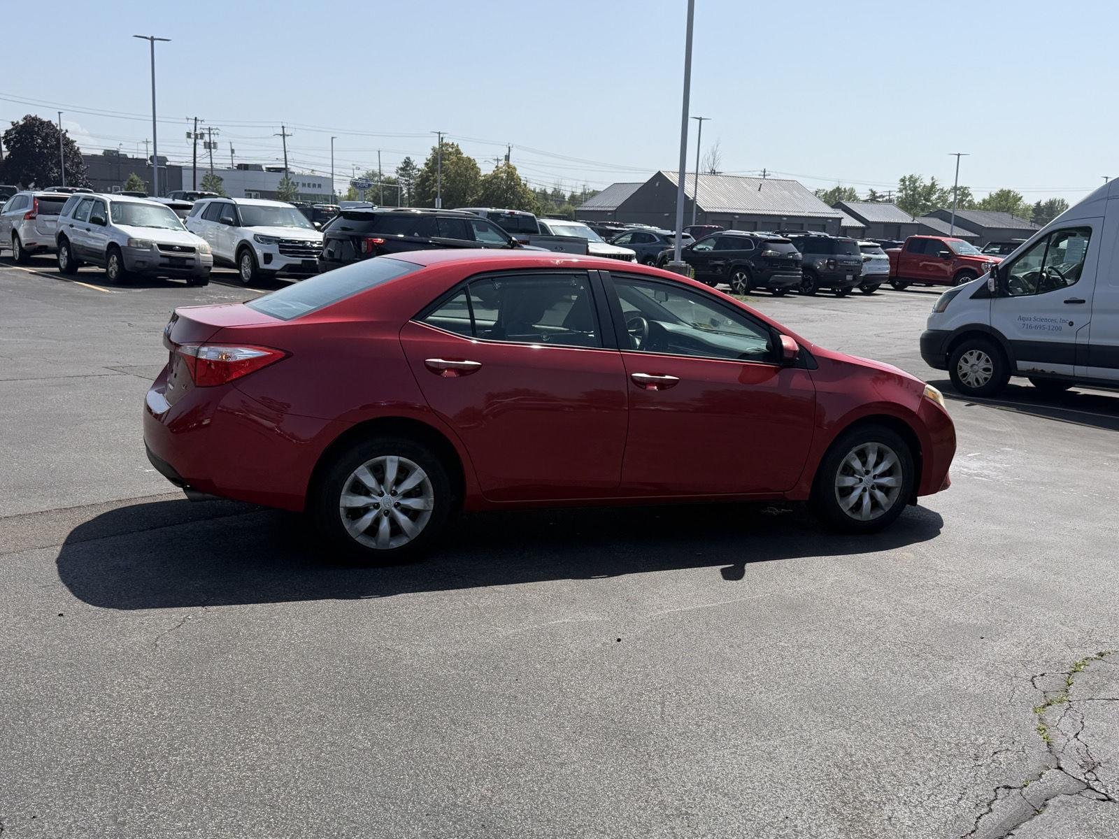 Used 2015 Barcelona Red Metallic Toyota LE image 5