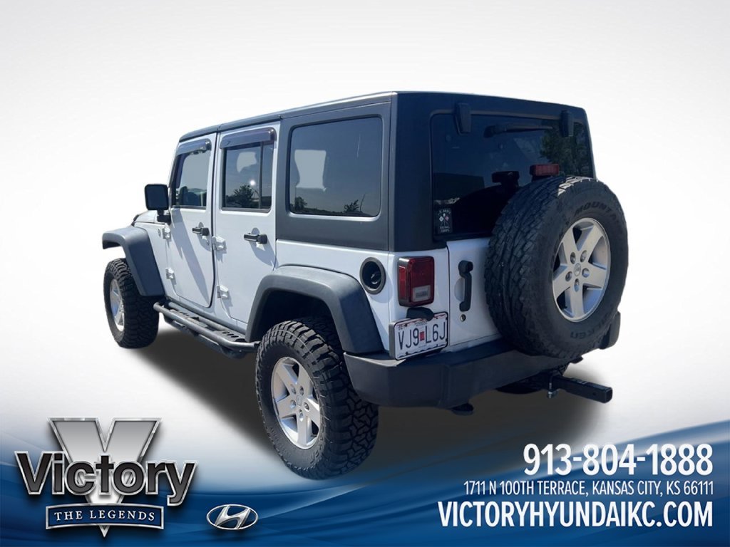 Used 2013 White Jeep Unlimited Sport image 3