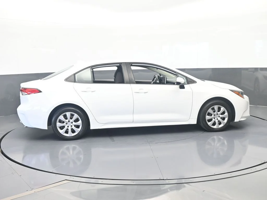 Used 2021 Super White Toyota LE image 6