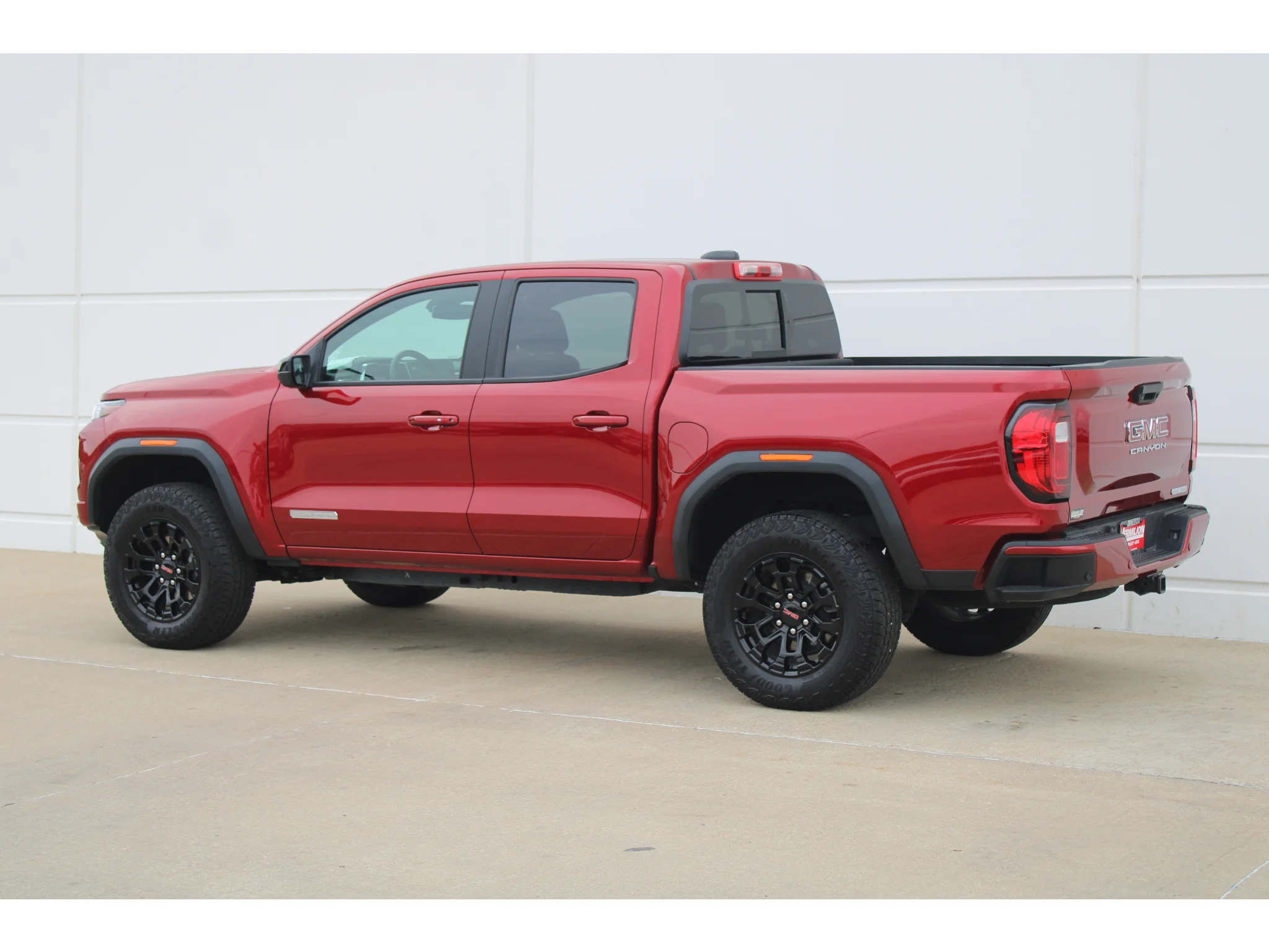 New 2026 VOLCANIC RED TINTCOAT GMC 2WD Elevation image 7
