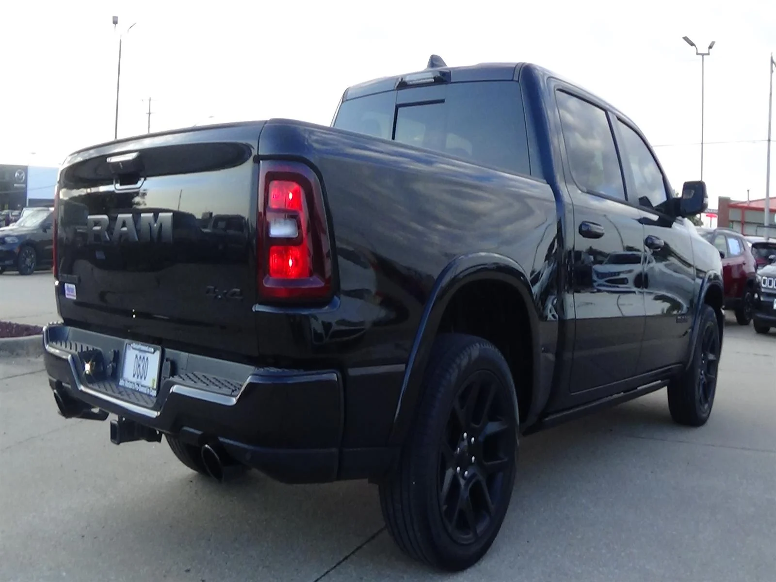 Used 2025 Diamond Black Crystal Pearl Coat (pxj) RAM Laramie image 6