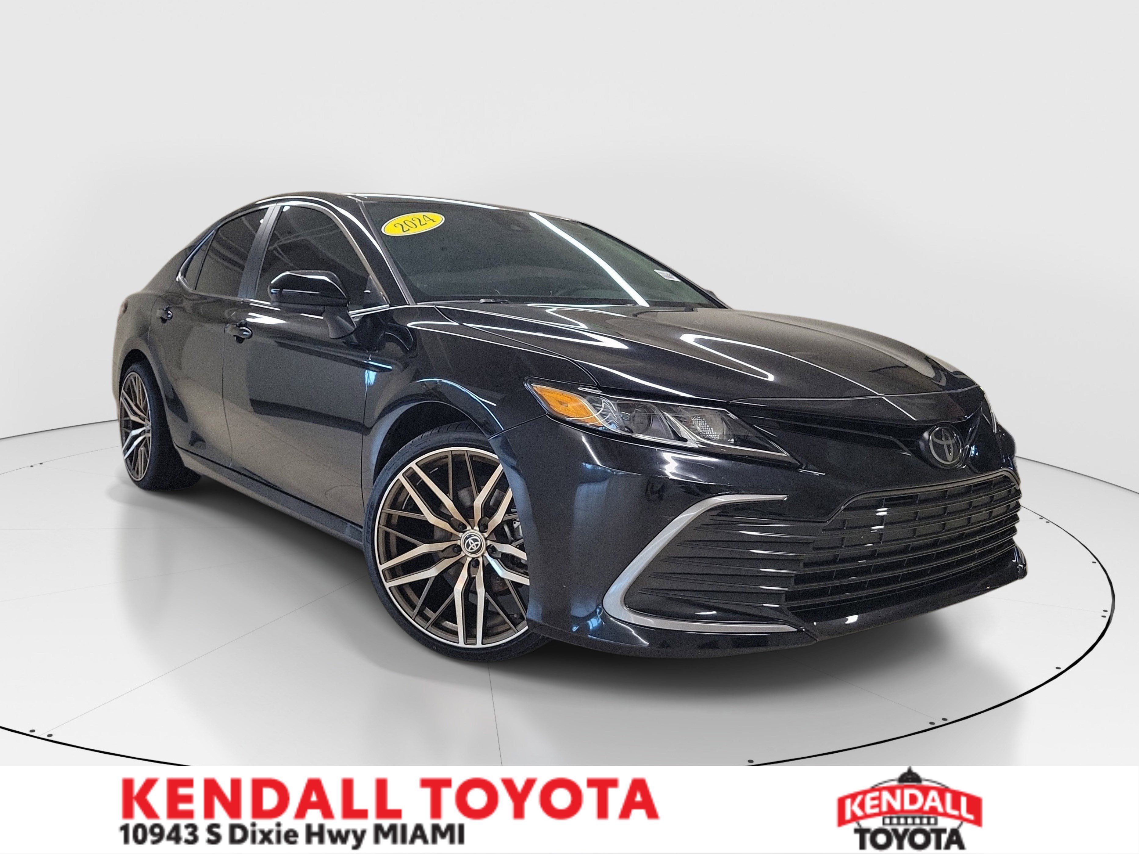 Used 2024 Midnight Black Metallic Toyota LE image 1