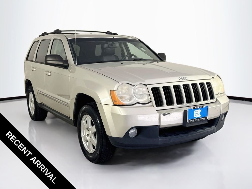 Used 2010 Light Graystone Pearlcoat Jeep Laredo image 1
