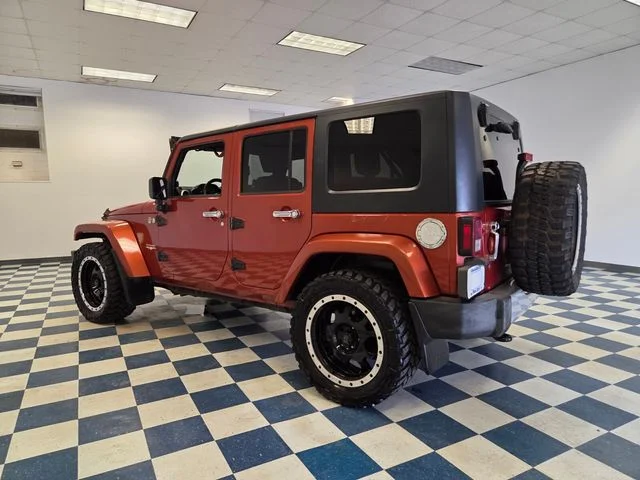 Used 2009 Orange Jeep Unlimited Sahara image 5