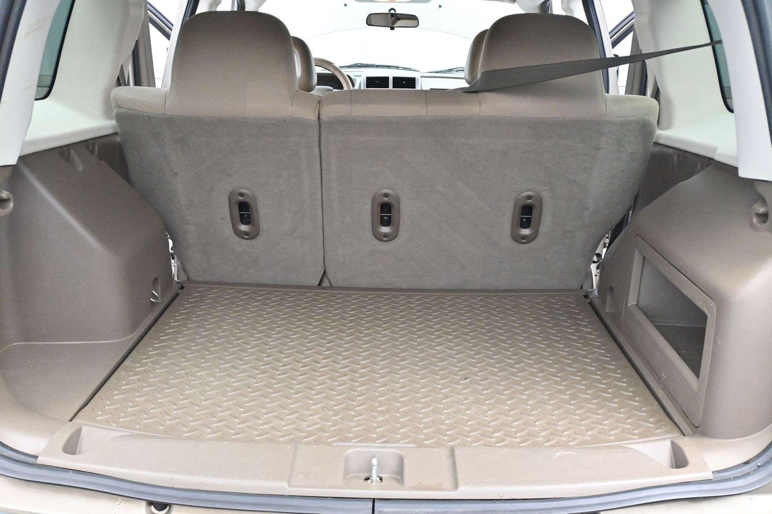 Used 2008 Light Khaki Metallic Jeep Sport image 9