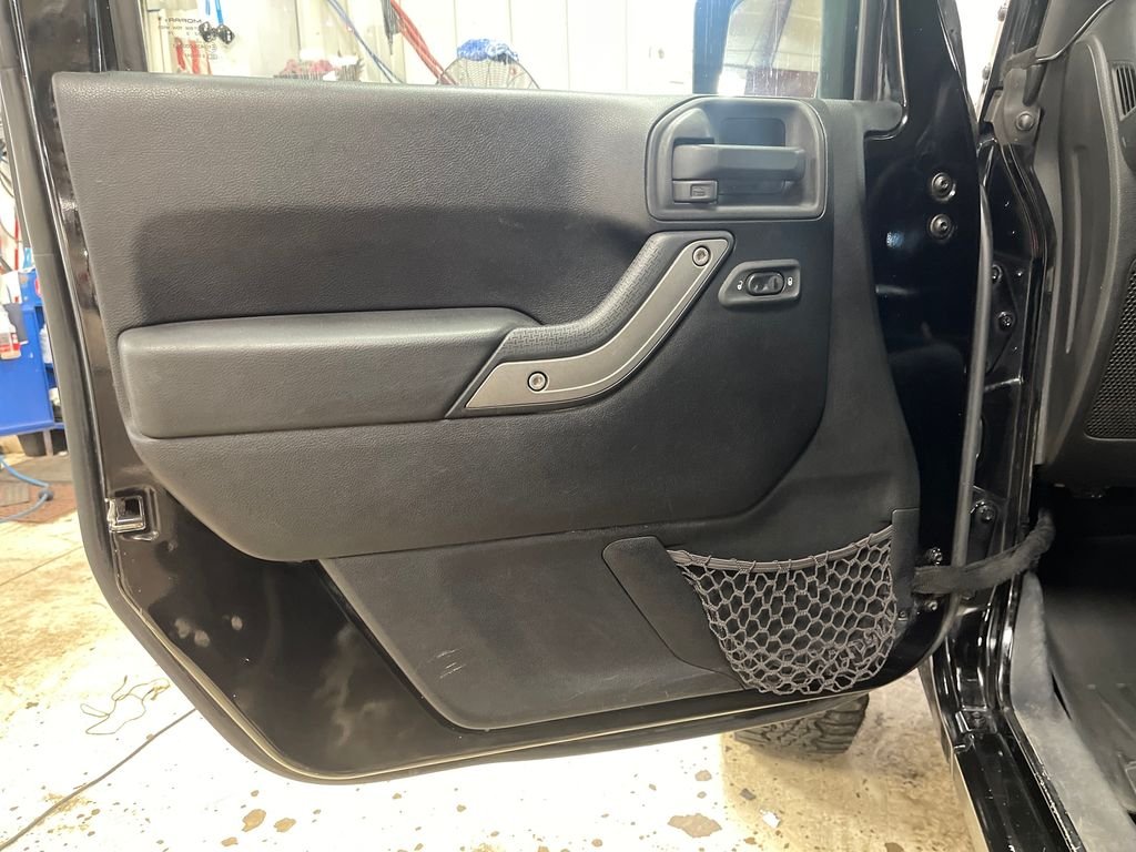 Used 2013 Black Jeep Unlimited Sport image 15