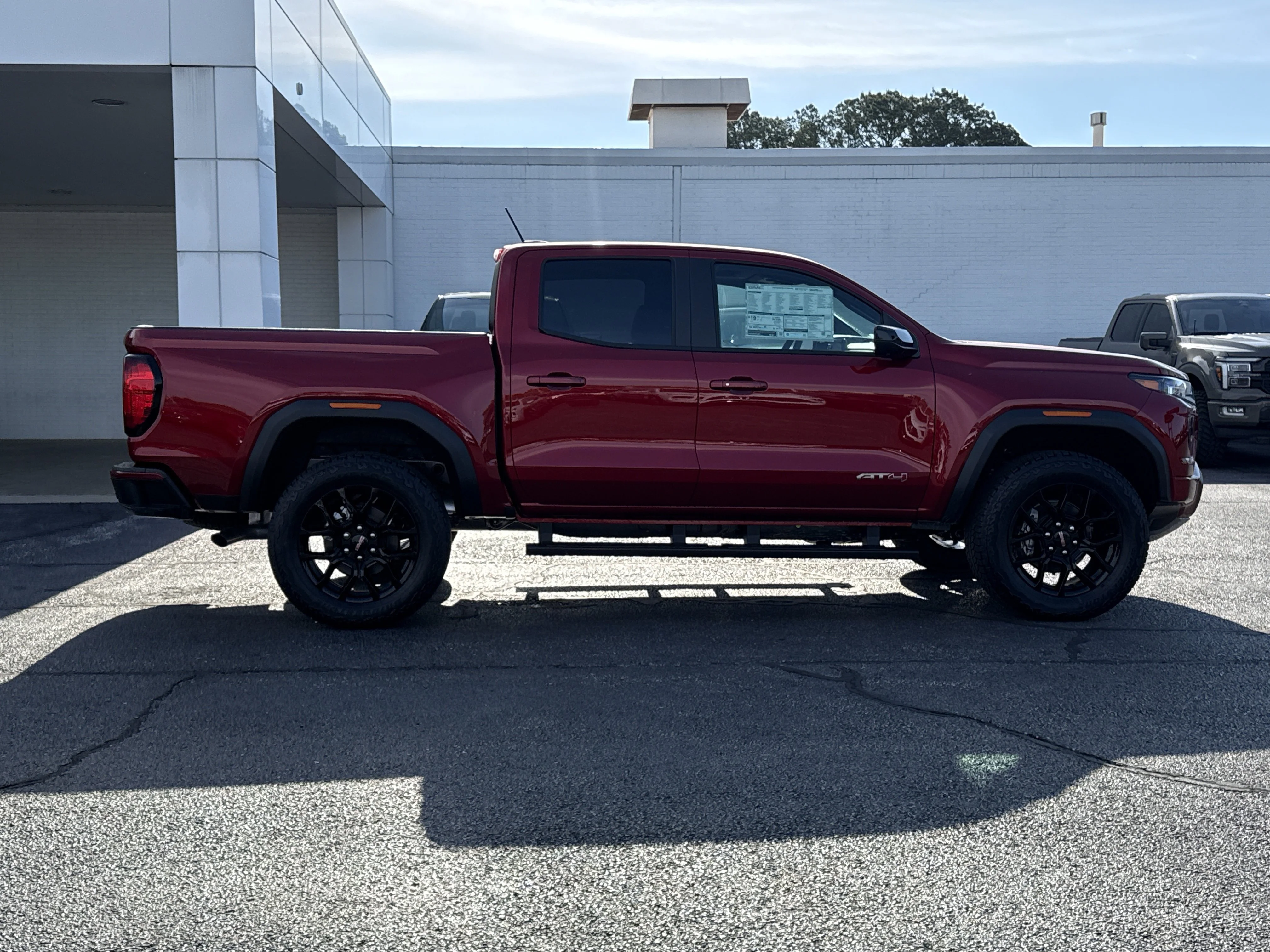 New 2026 Volcanic Red Tintcoat GMC 4WD AT4 image 2
