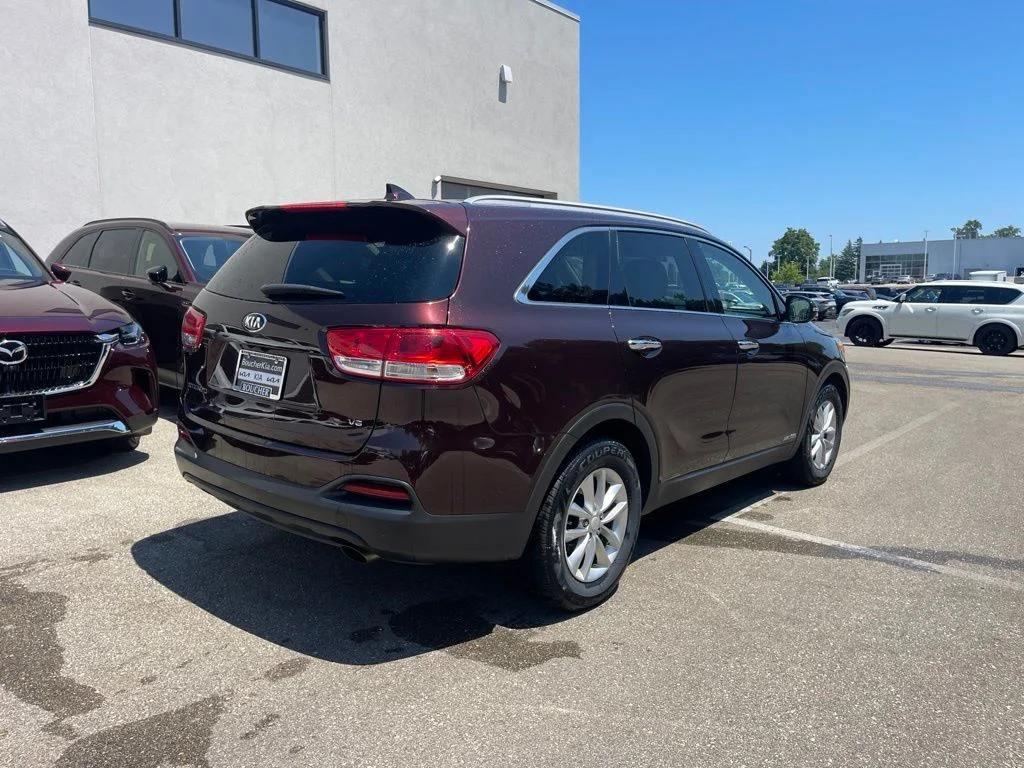 Used 2016 Dark Cherry Kia LX image 3