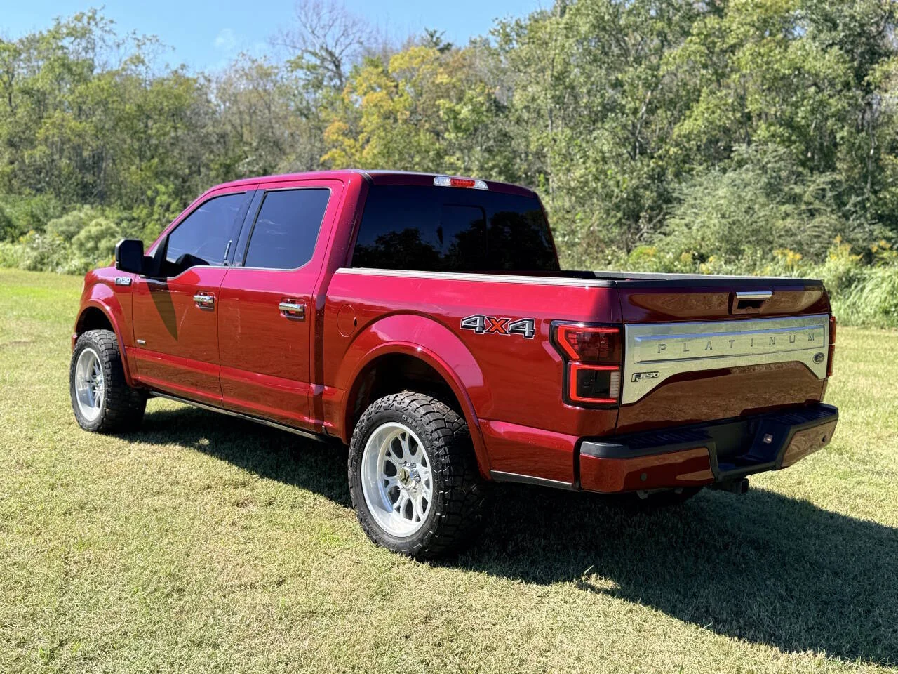 Used 2015 Red Ford Platinum 4x4 4dr SuperCrew 5.5 ft. SB image 4