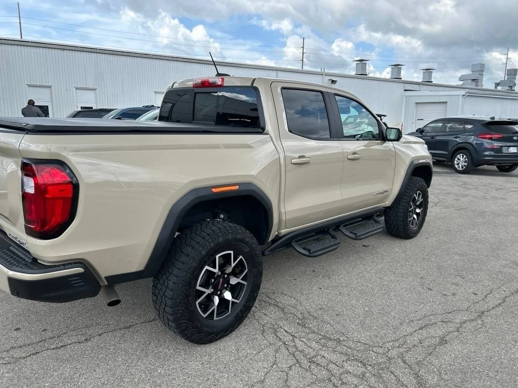 Used 2023 Desert Sand Metallic GMC AT4X image 4