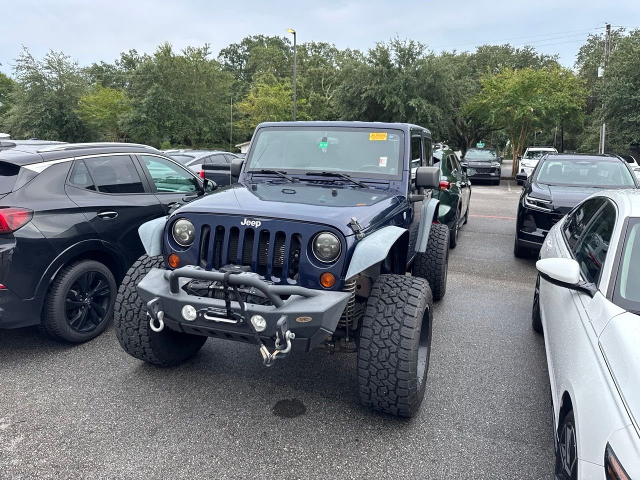 Used 2013 Blue Jeep Sport image 1