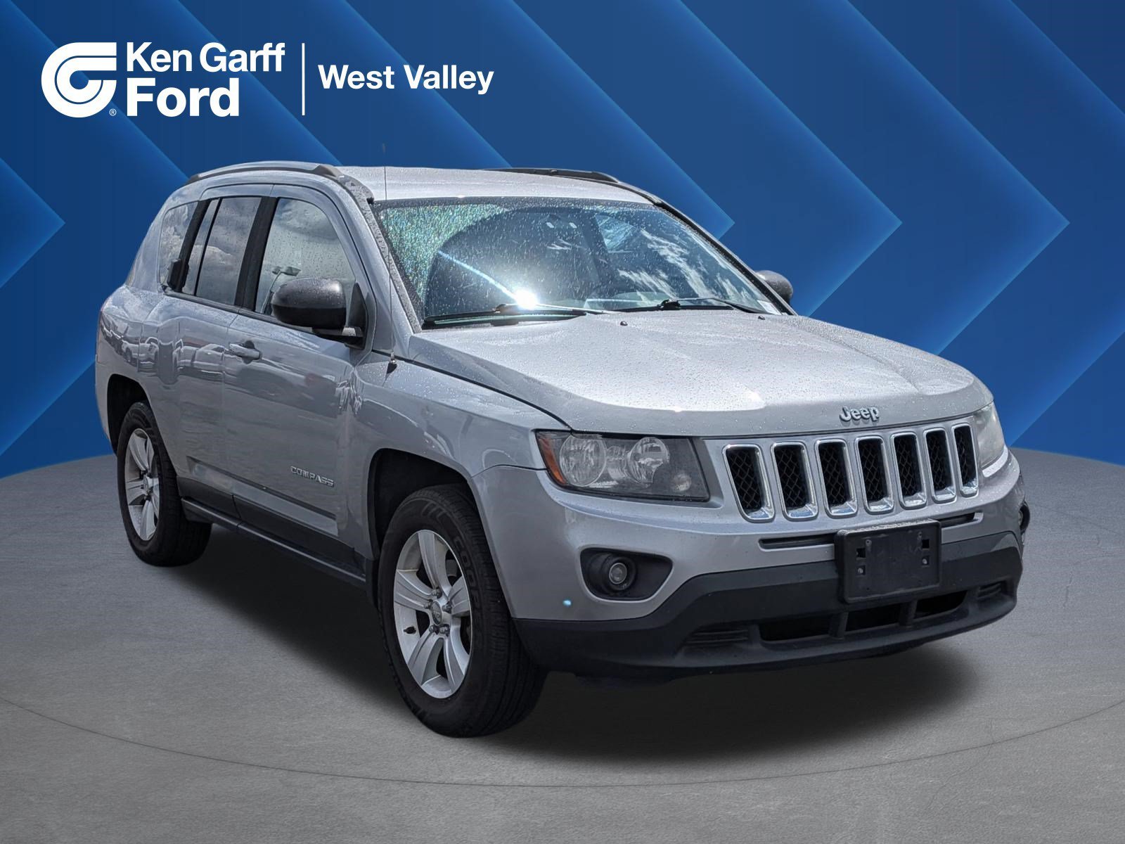 Used 2014 Billet Silver Clearcoat Metallic Jeep Sport image 1