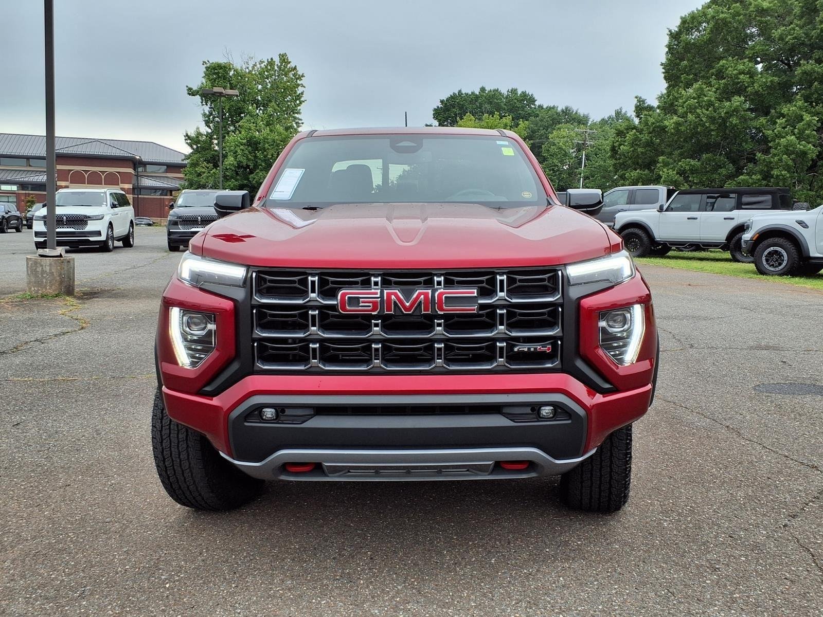 Used 2025 Volcanic Red Tintcoat GMC 4WD AT4 image 9