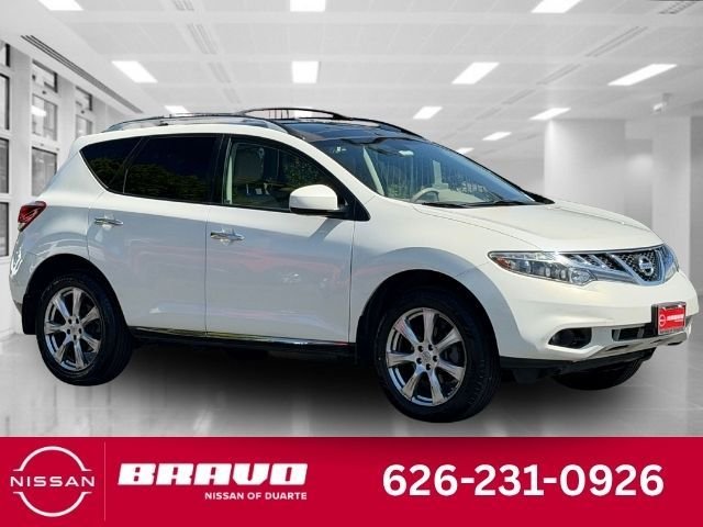 Used 2012 White Nissan LE image 1