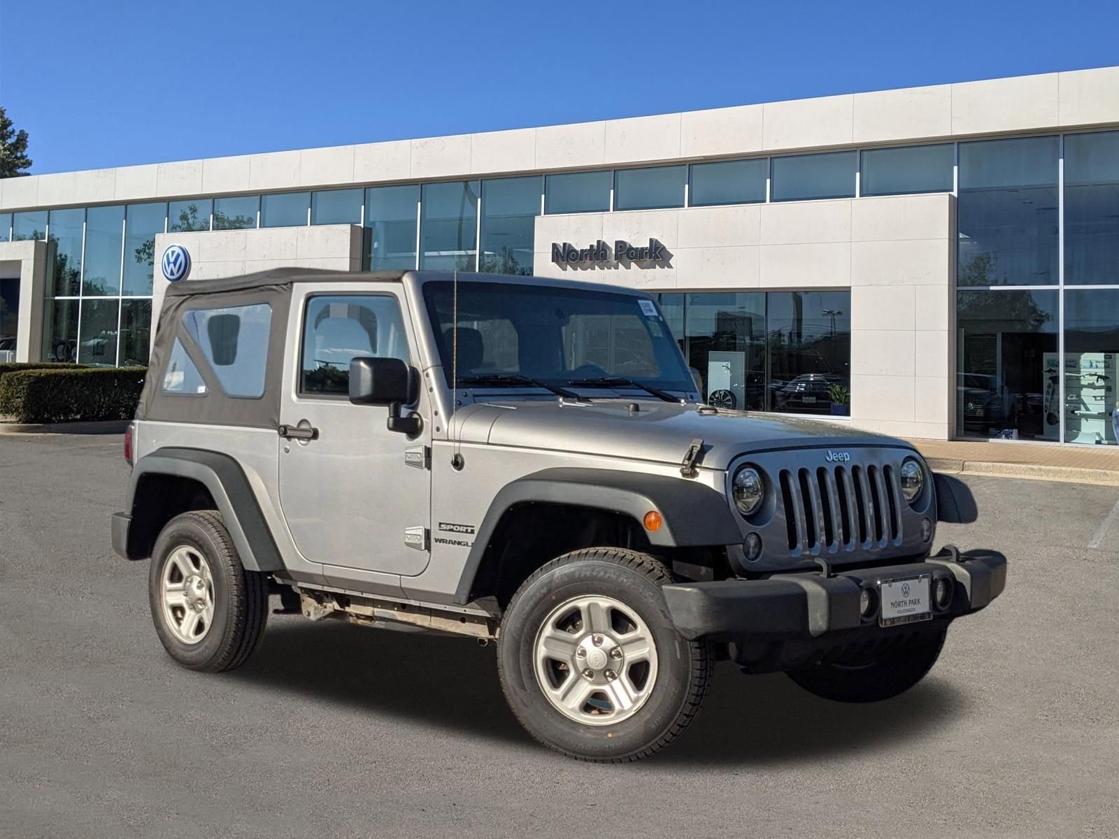 Used 2015 Billet Silver Metallic Clearcoat Jeep Sport image 1