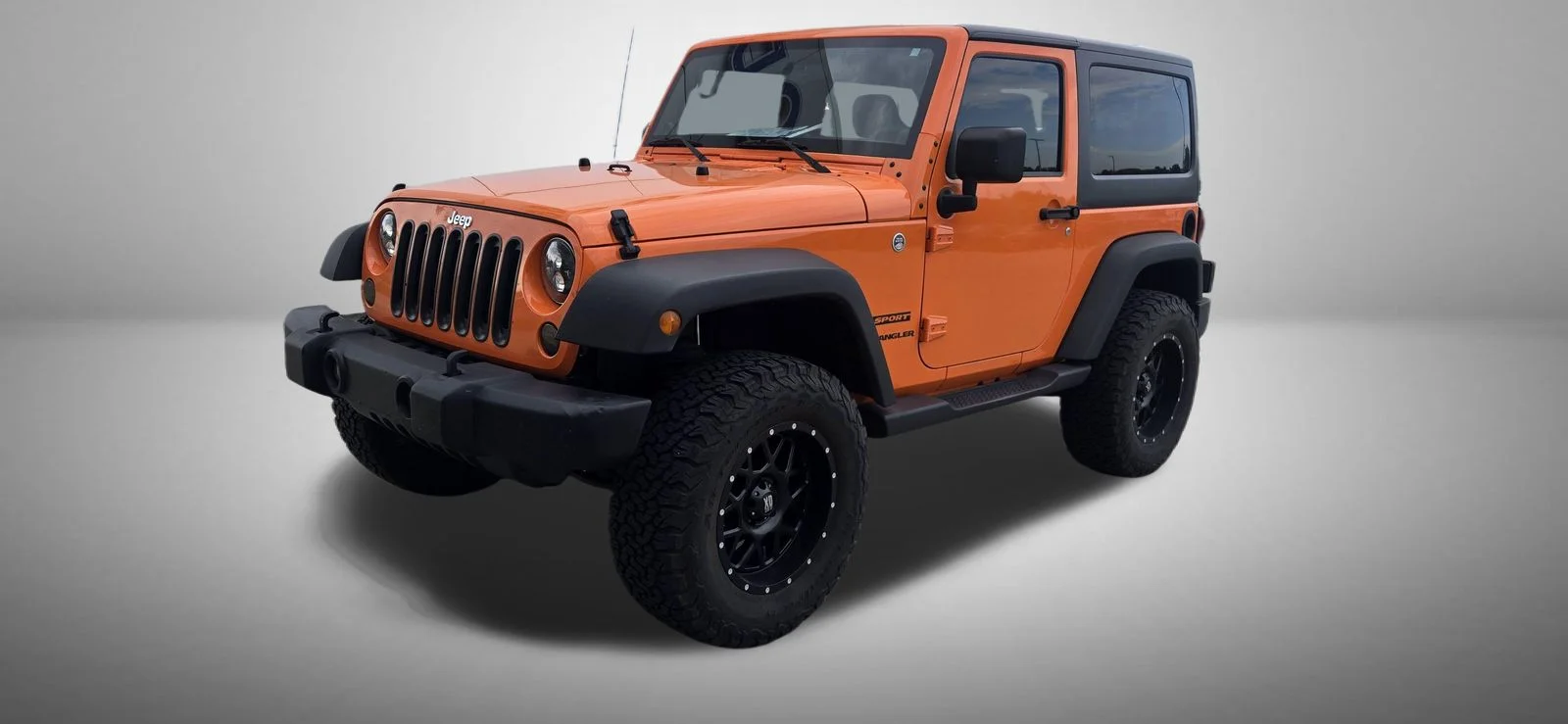 Used 2012 Orange Jeep Sport image 1