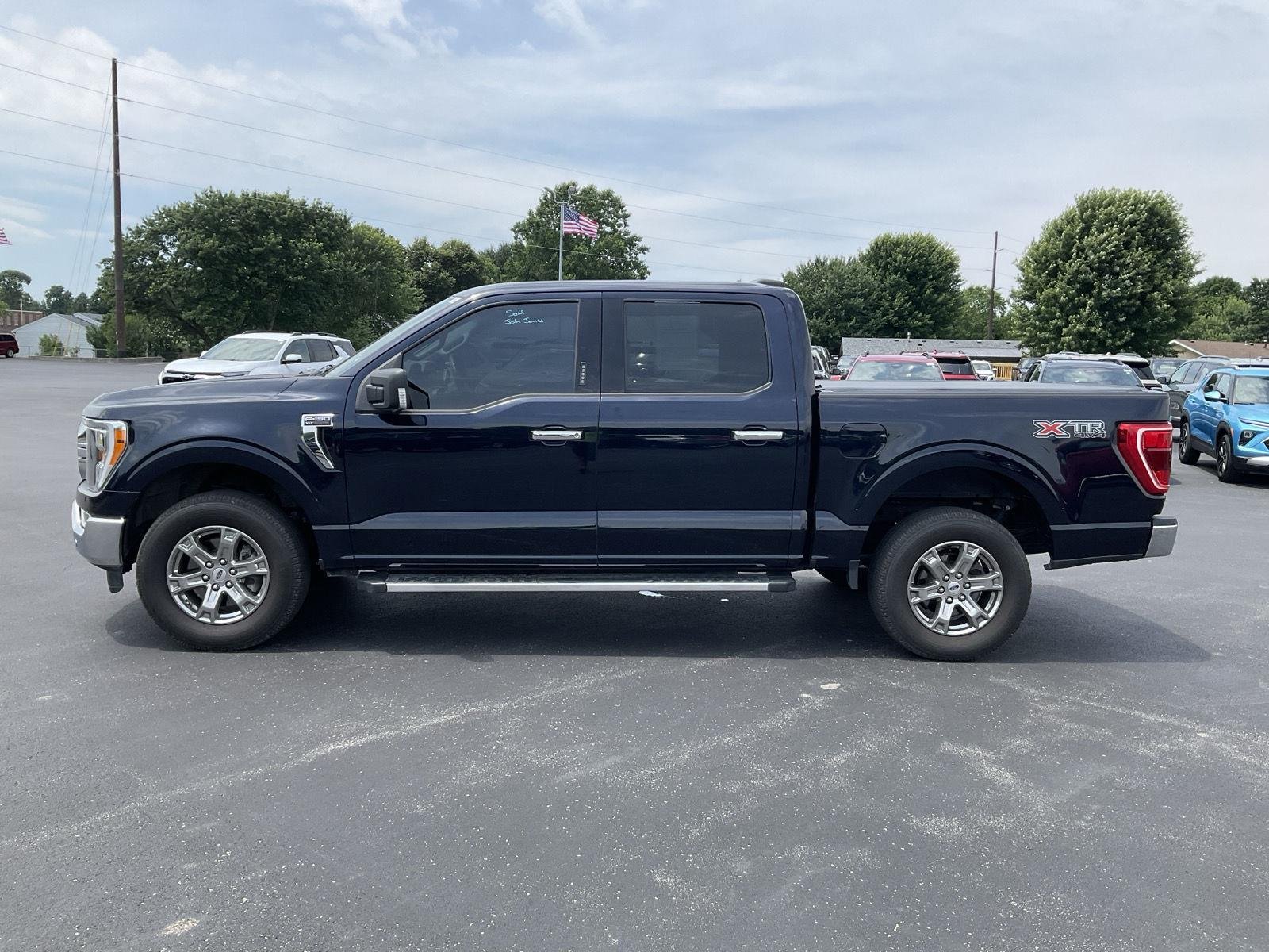 Used 2023 Antimatter Blue FORD XLT 4WD SUPERCREW 5.5