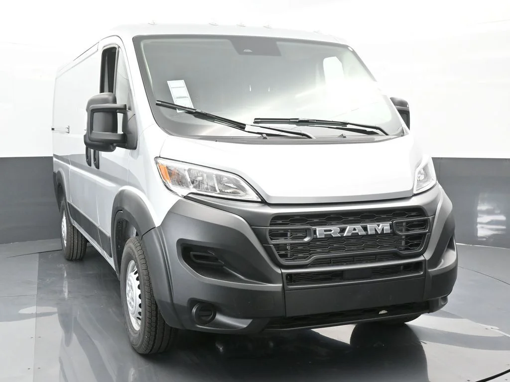 Used 2025 Bright Silver Clearcoat Metallic Ram Low Roof image 9